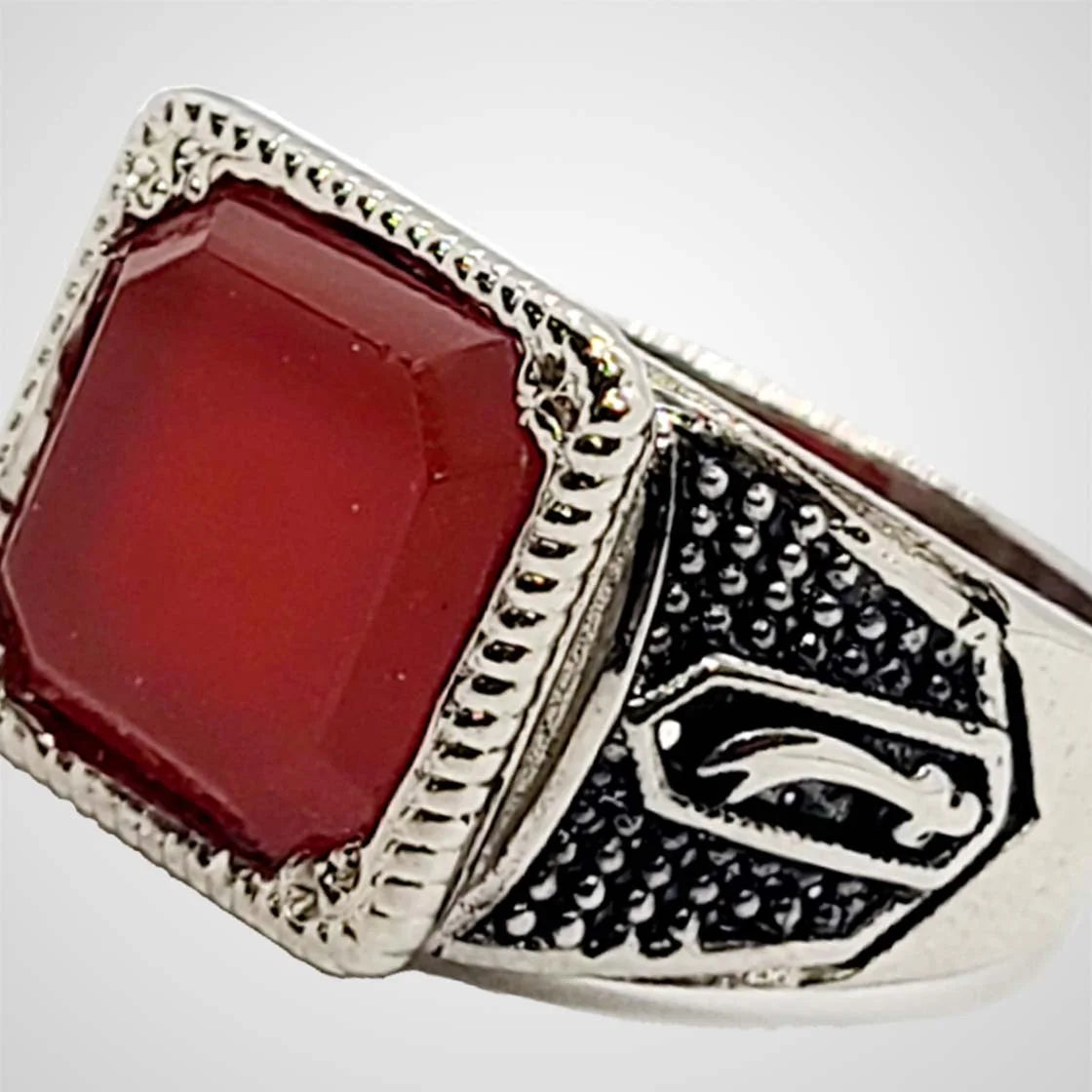 Side angle of dark brown aqeeq stone ring set in silver, showcasing intricate handmade detailing for men