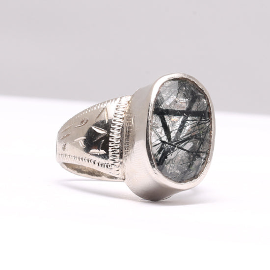 A silver ring featuring a brightly cut mohe najaf stone, set in a polished silver band with intricate detailing. Moh-e-Najaf Ladies Silver Ring for Women
