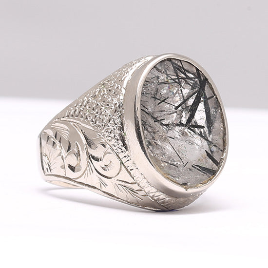 A silver ring with a Mohe Najaf stone, encased in a silver setting with decorative elements on the band.Mohe Najaf Silver Rings Stone of Imam Ali (as) 