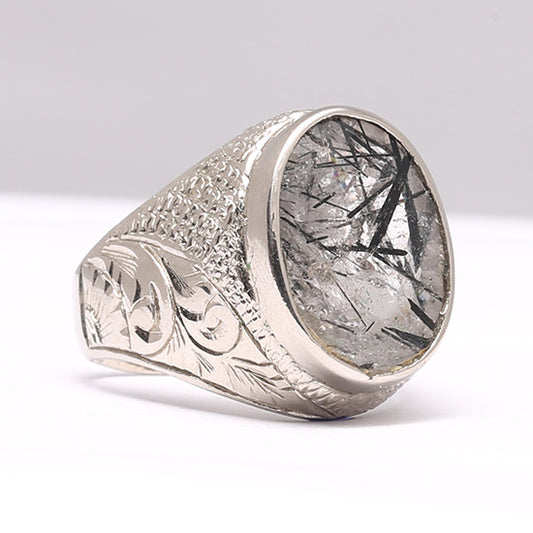 A silver ring with a Mohe Najaf stone, encased in a silver setting with decorative elements on the band.Mohe Najaf Silver Rings Stone of Imam Ali (as) 